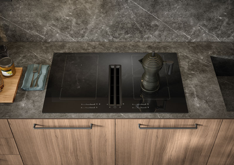 Cucina Domino con top in gres e basi in melaminico noce Canaletto.